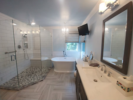 Brighton bathroom with a curbless walk in shower and glass enclosure